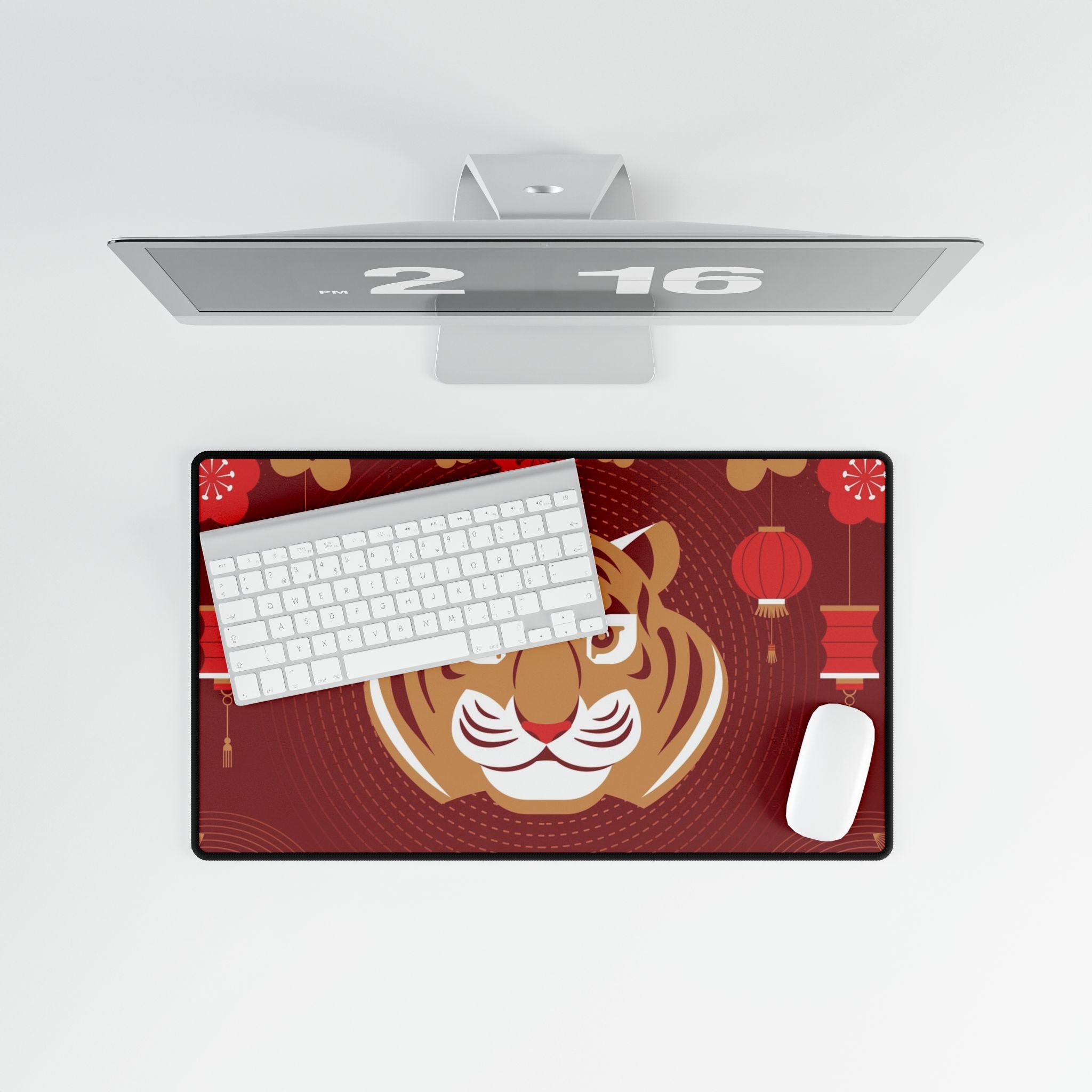 Desk setup with a tiger-themed mouse pad, keyboard, and mouse on a white background
