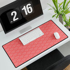 Desk setup with a red patterned mouse pad, keyboard, and computer monitor.