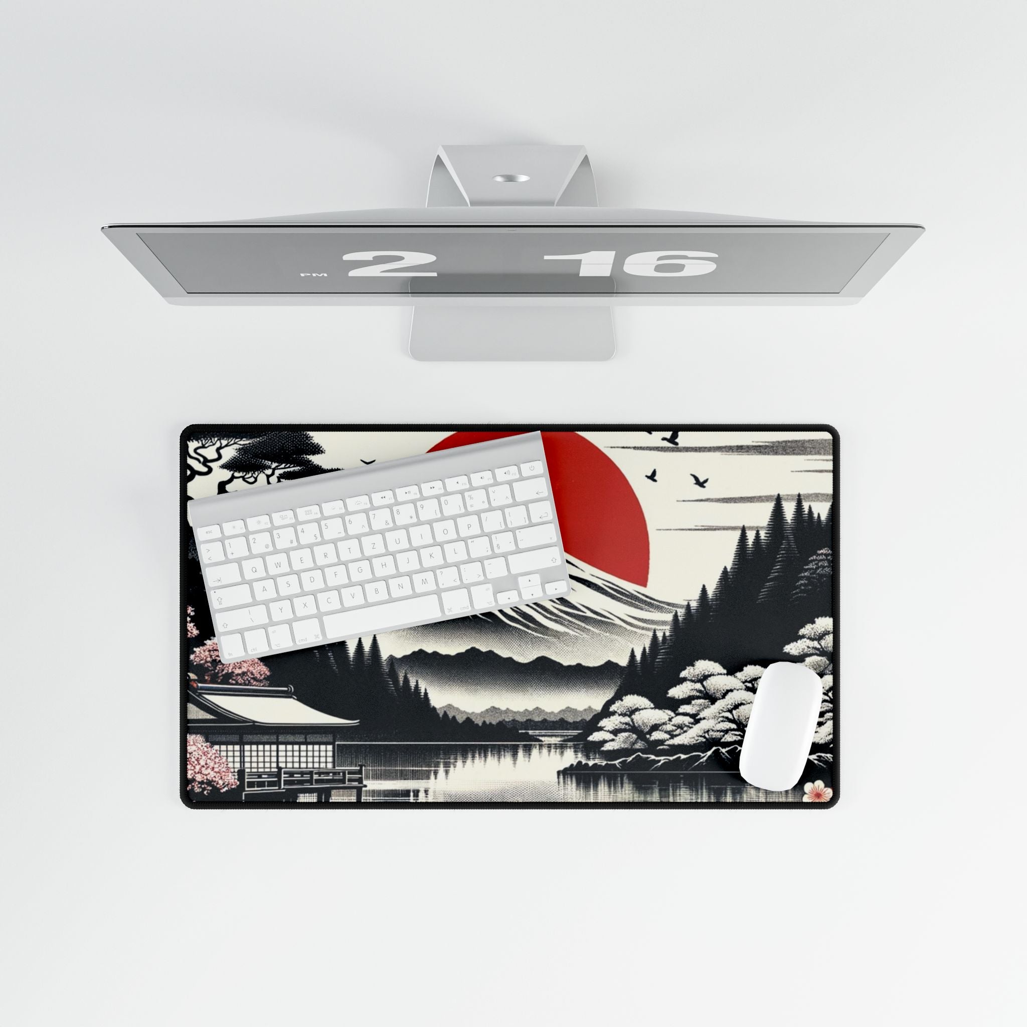 Desk setup with a large mouse pad featuring a scenic design, keyboard, and mouse on a white background.