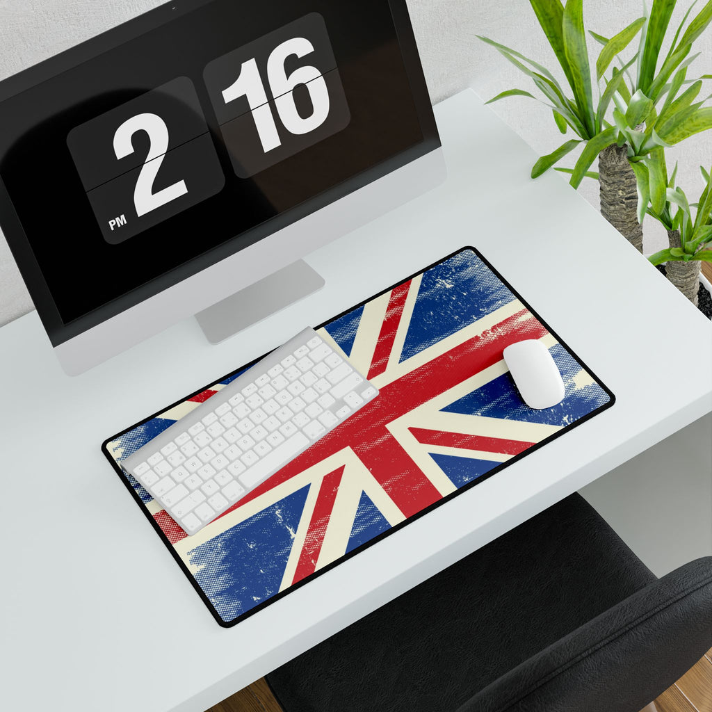 Desk setup with a Union Jack design mouse pad, keyboard, and computer.
