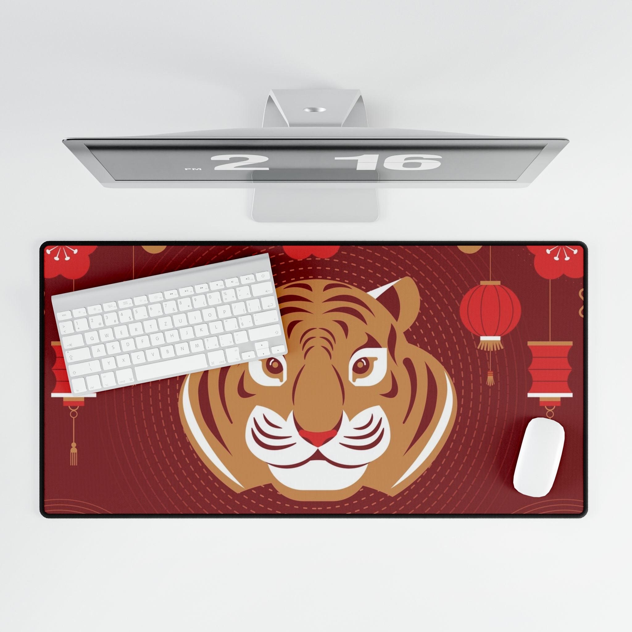 Desk setup with a large mouse pad featuring a tiger design on a red background.