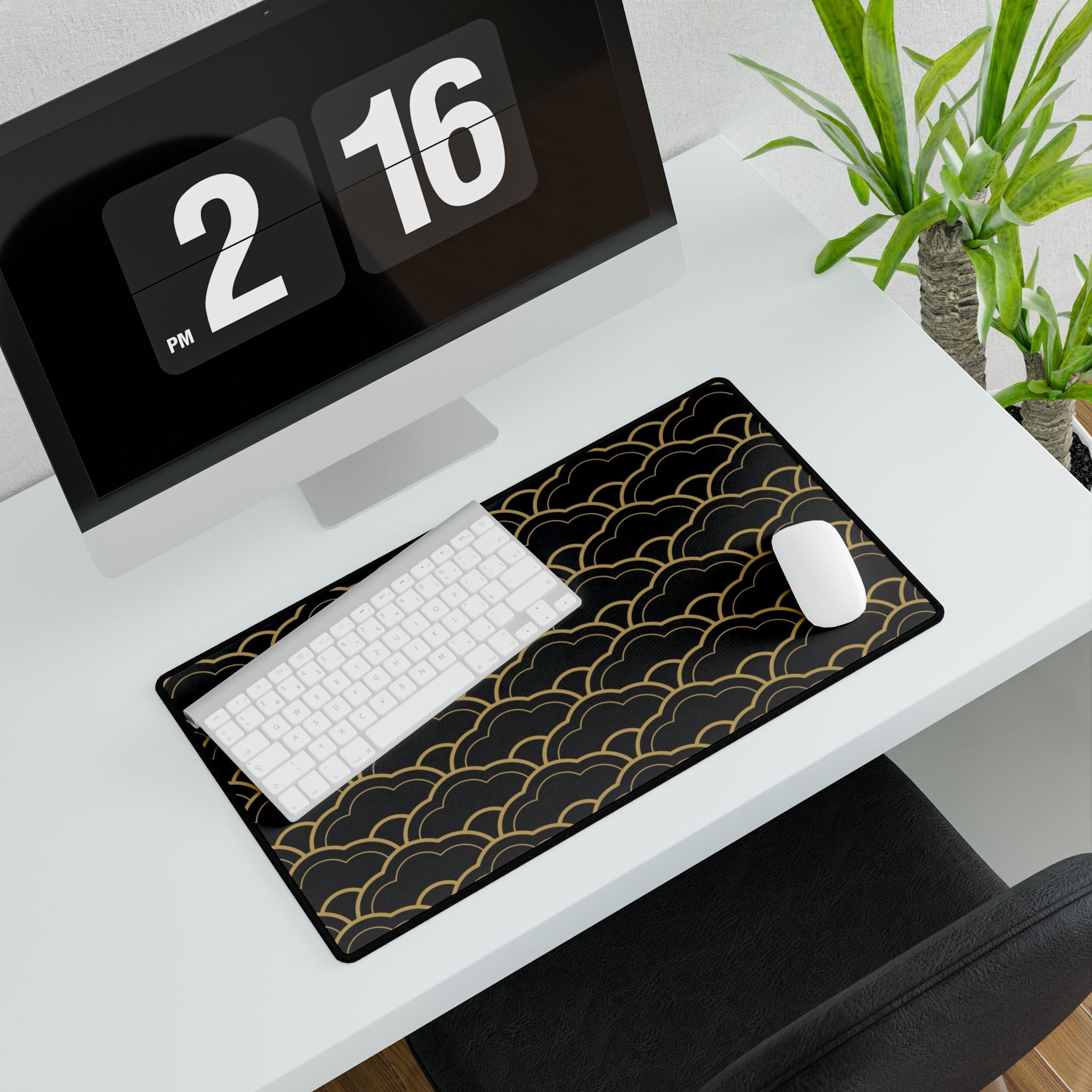 Black and gold patterned desk mat on a white desk with a computer and mouse.