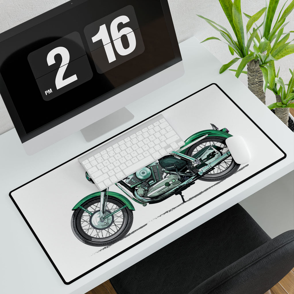 Desk setup with a motorcycle design mouse pad, keyboard, and digital clock.