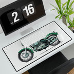 Desk setup with a motorcycle design mouse pad, keyboard, and digital clock.