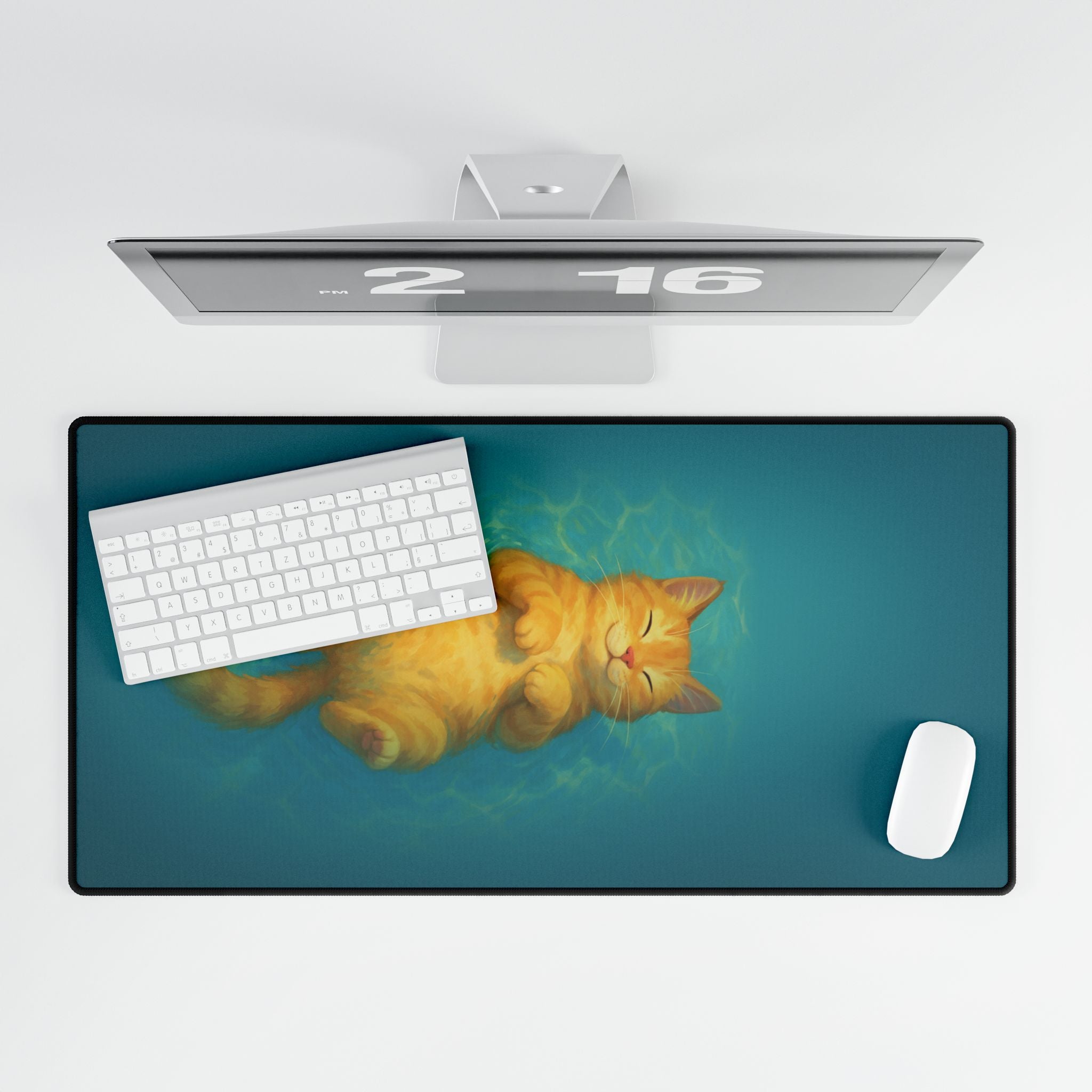 Desk setup with a large mouse pad featuring a cat design, keyboard, and mouse.