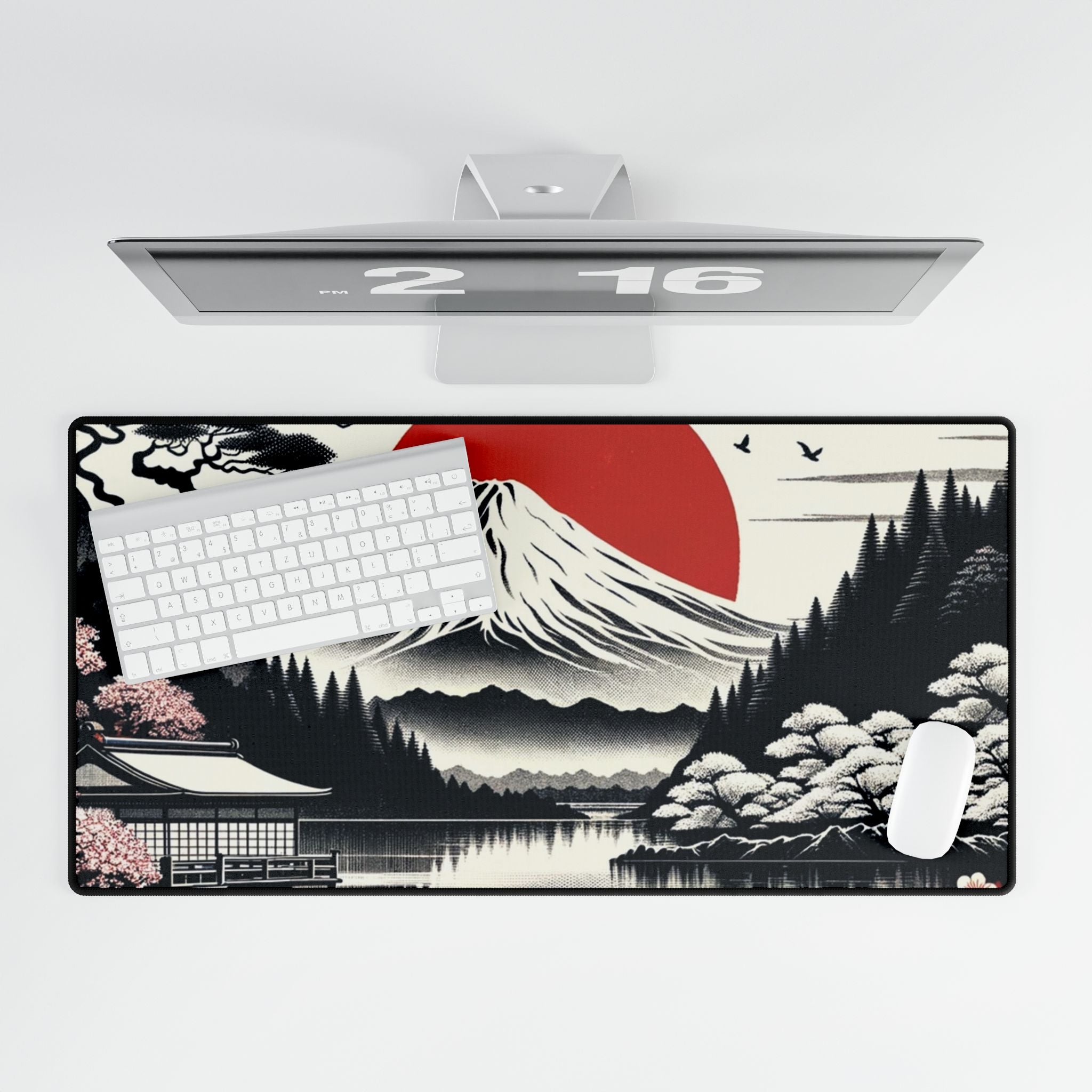 Desk setup with a large desk mat featuring a mountain design, keyboard, and mouse.