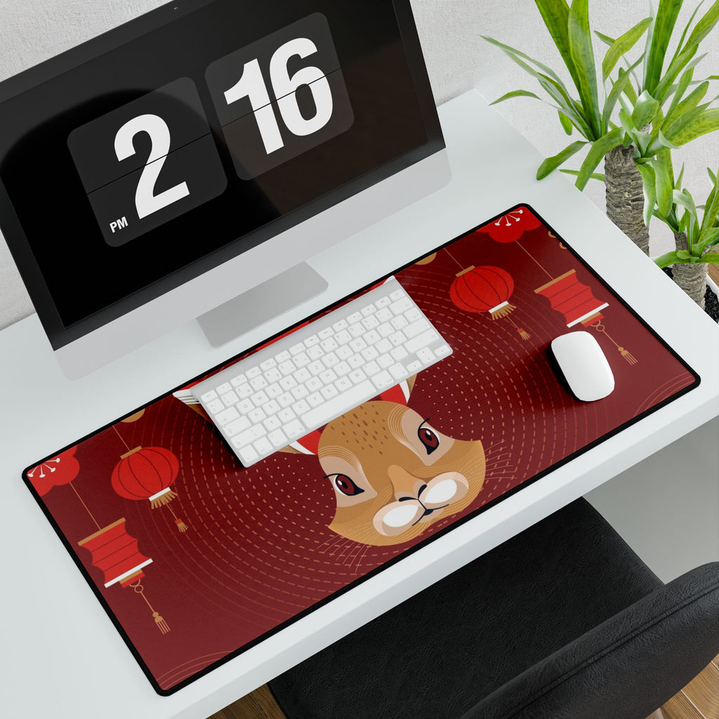 Desk setup with a large mouse pad featuring a cartoon deer, keyboard, and mouse on a desk.
