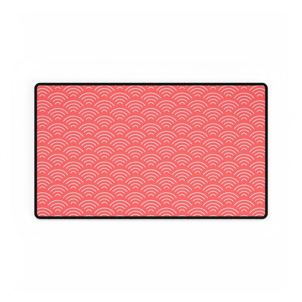 Rectangular pink patterned mat with a black border on a white background
