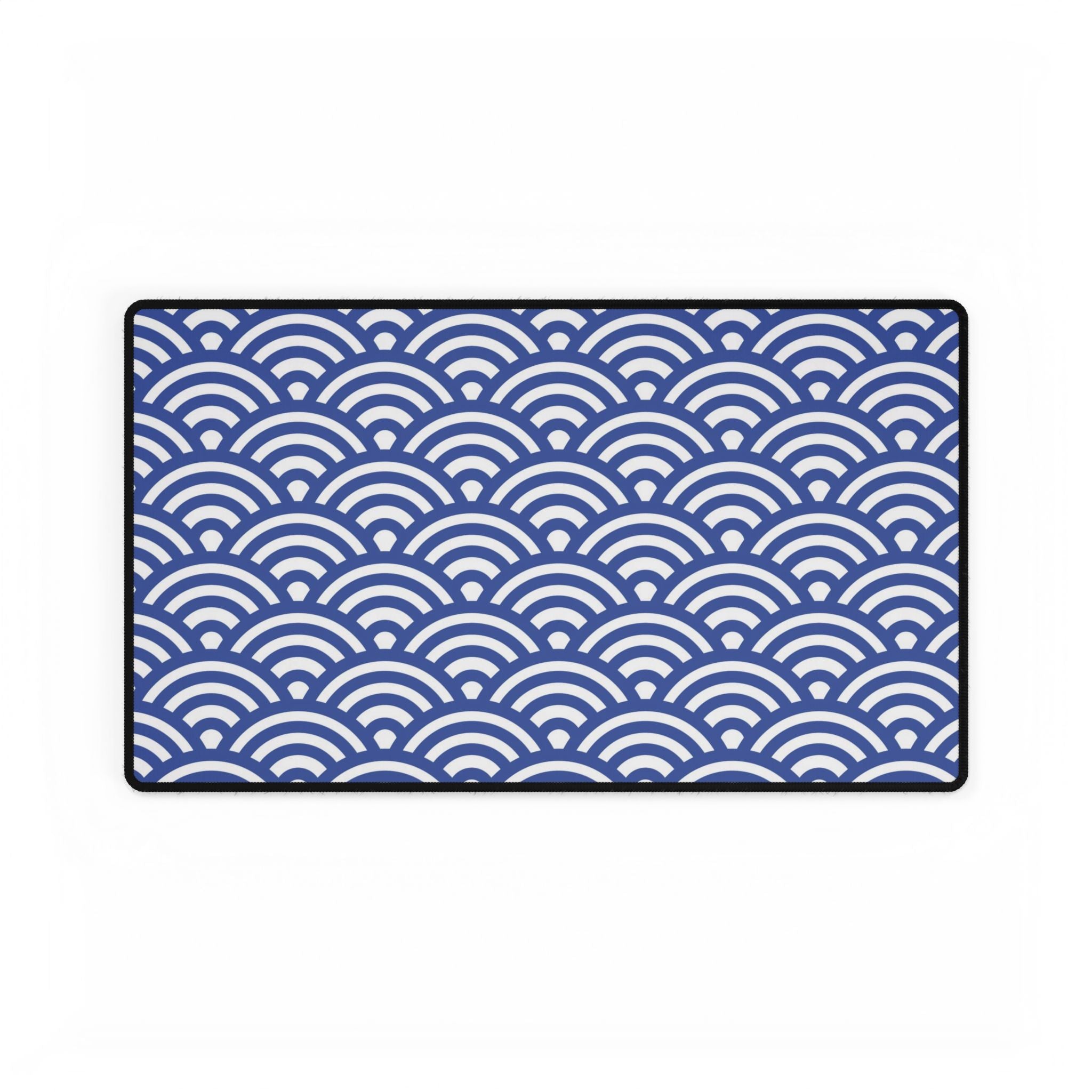 Blue and white wave patterned rug on a white background