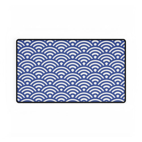 Blue and white wave patterned rug on a white background