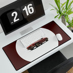 Desk setup with a computer monitor, keyboard, mouse, and large mouse pad featuring a car design.
