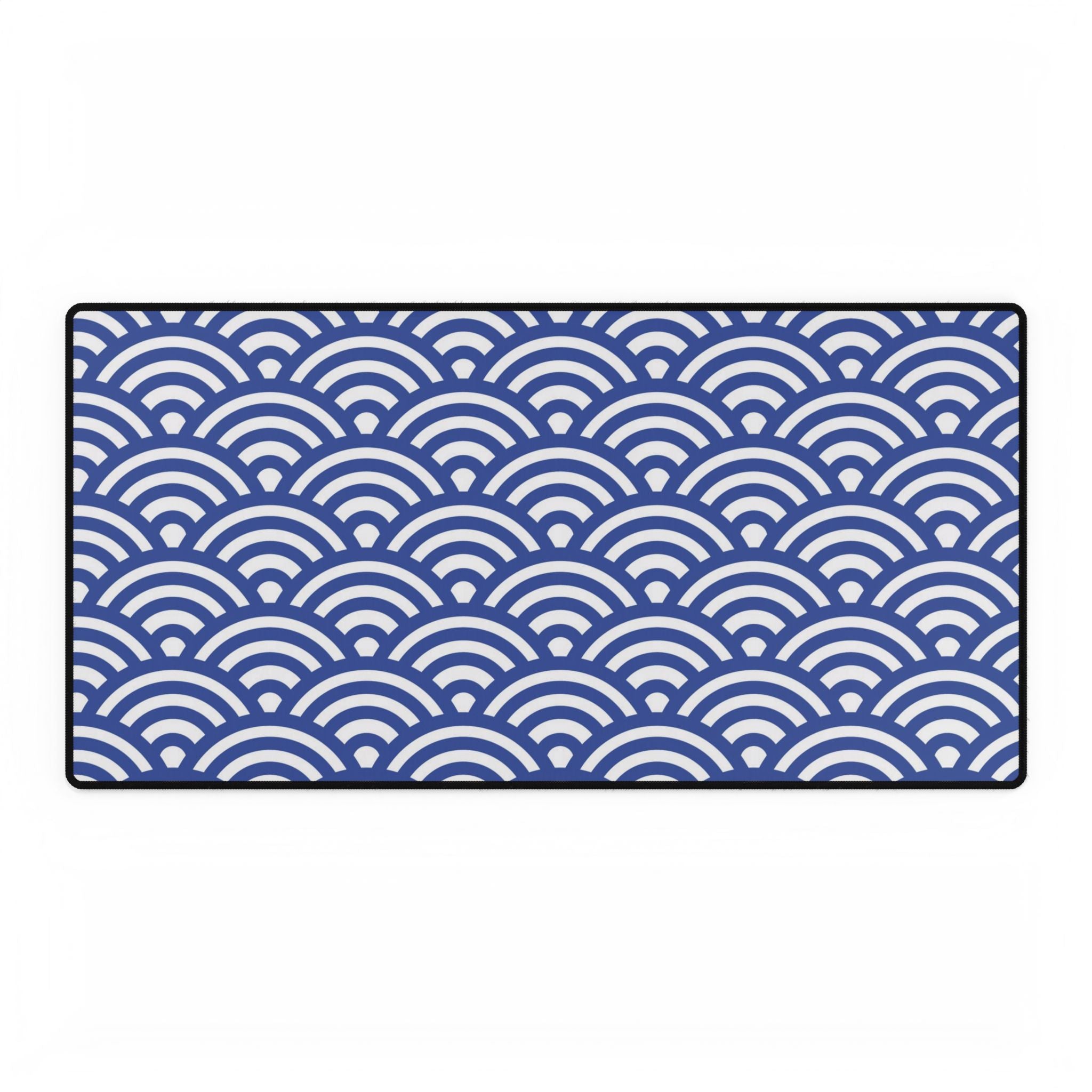 Rectangular mat with blue and white wave pattern on a white background