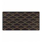 Black mat with gold wave pattern on a white background