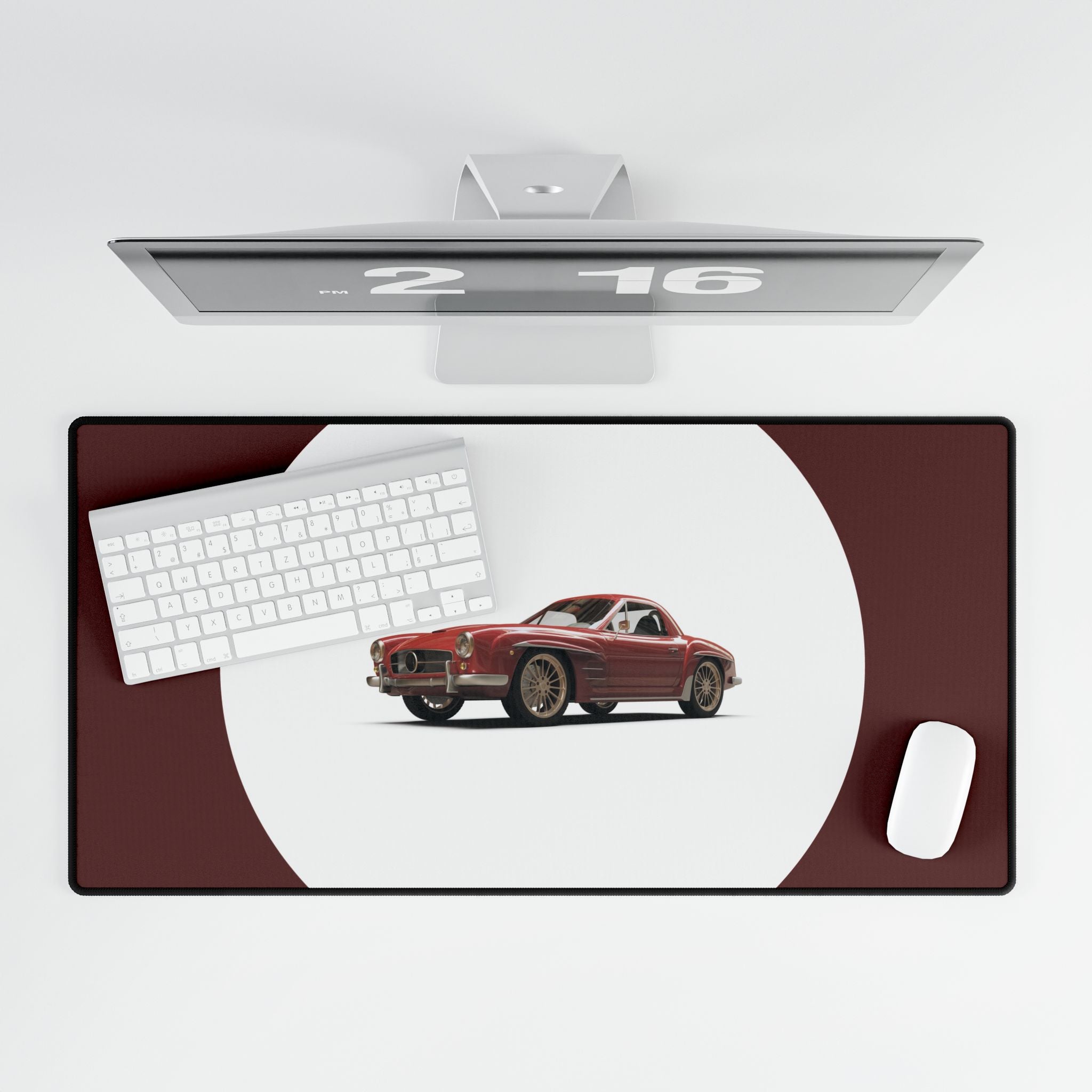 Desk mat with a red car design, keyboard, and computer monitor on a white background
