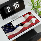 Desk setup with a large American flag mouse pad, computer monitor, keyboard, and mouse.