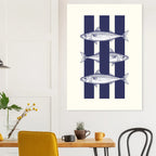 Poster with fish design on a wall above a dining table with chairs.