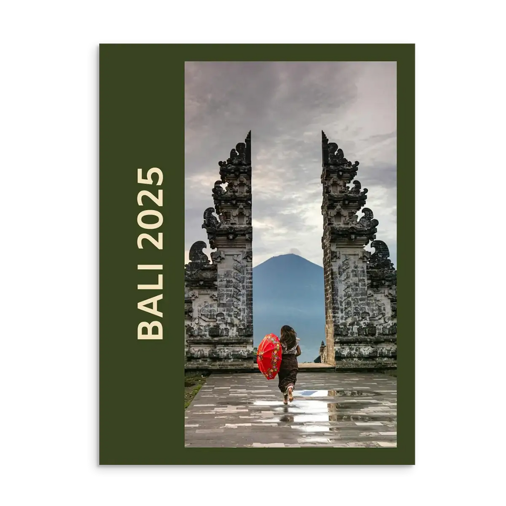 Bali Travel Photo Book with stone gate and person holding a red umbrella, featuring 'Bali 2025' text.