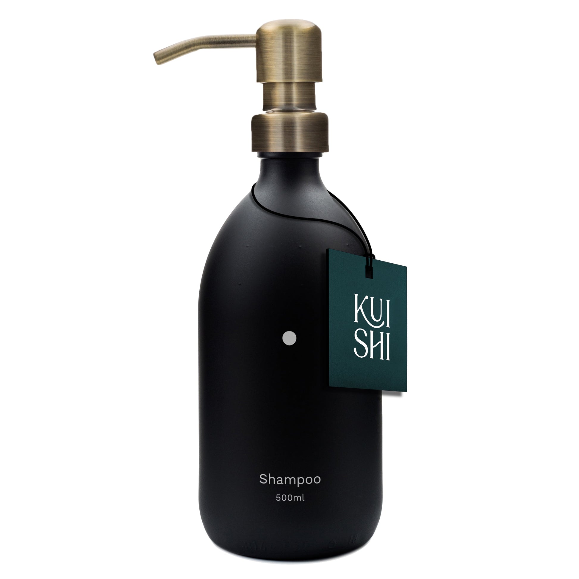 Black shampoo bottle with brass pump and 'Kushi' label on a white background