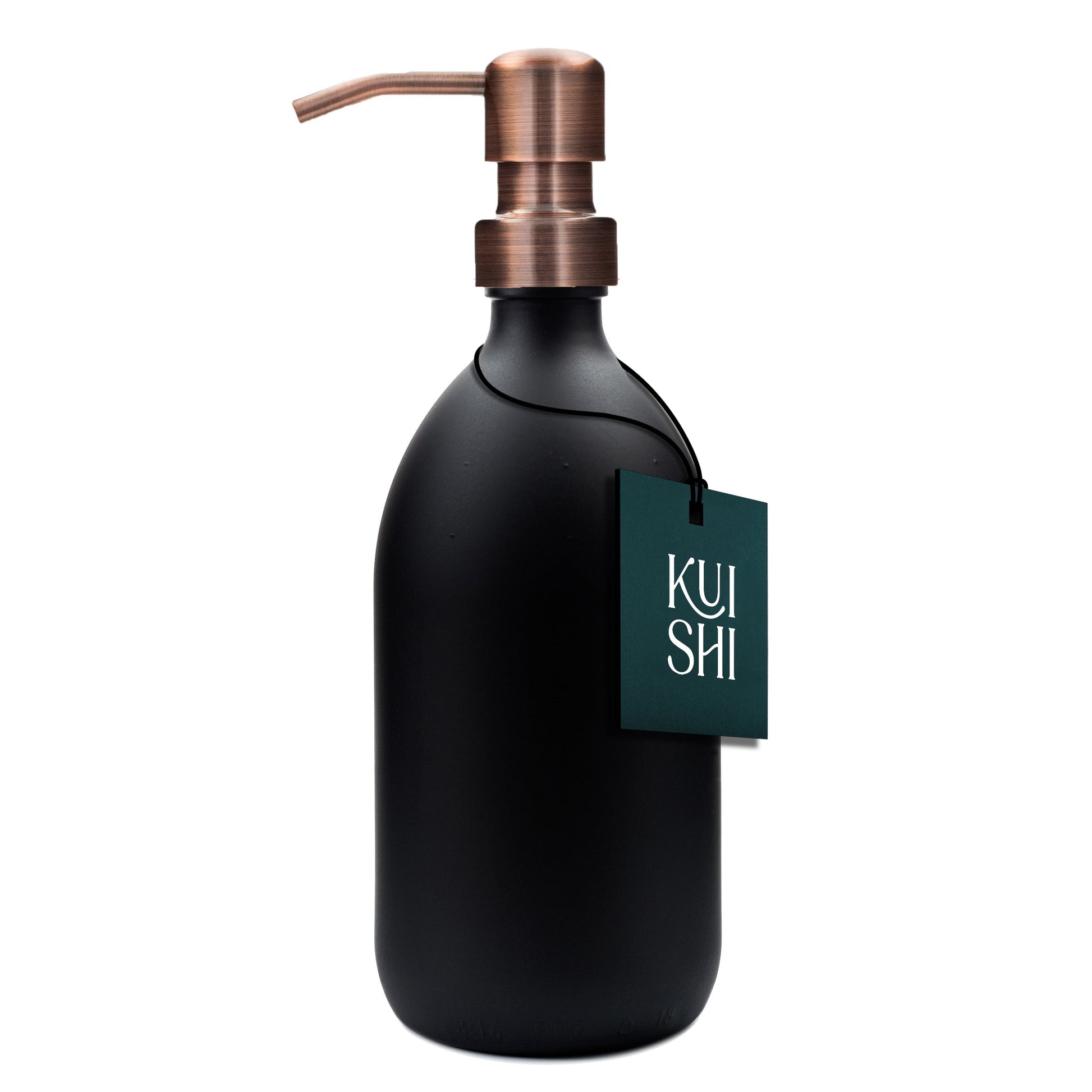 Black soap dispenser with copper pump and 'Kushi' tag on a white background