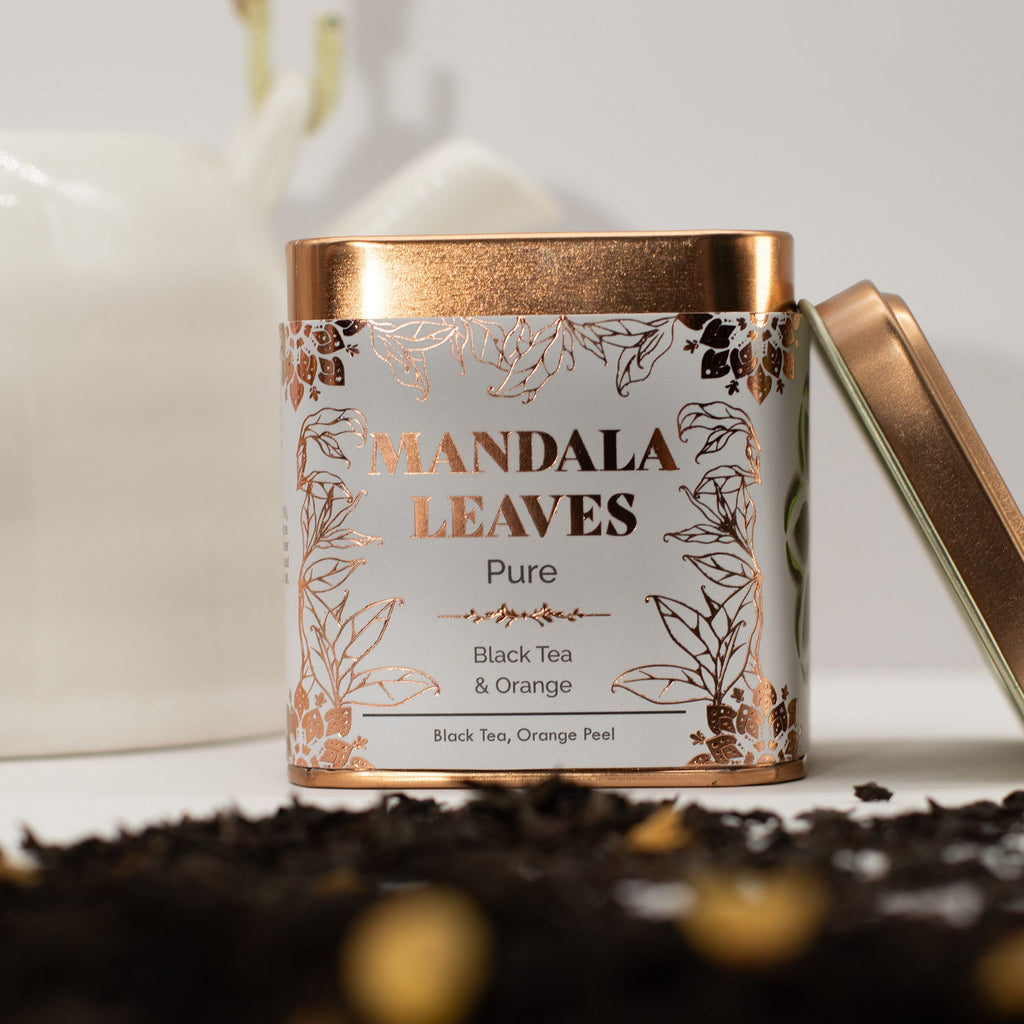 Tea canister labeled 'Mandala Leaves' with a decorative design on a light background.