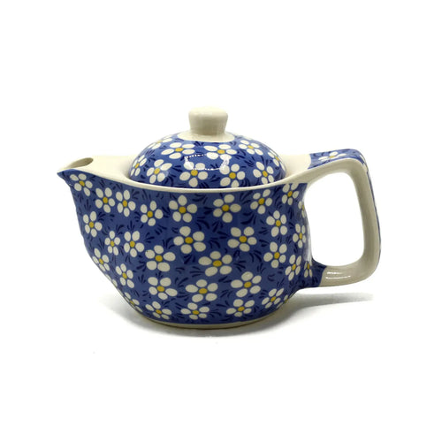 Teapot with blue floral pattern on a white background