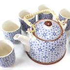 Ceramic teapot and cups with blue geometric pattern on a white background from MVB STUDIO official store.