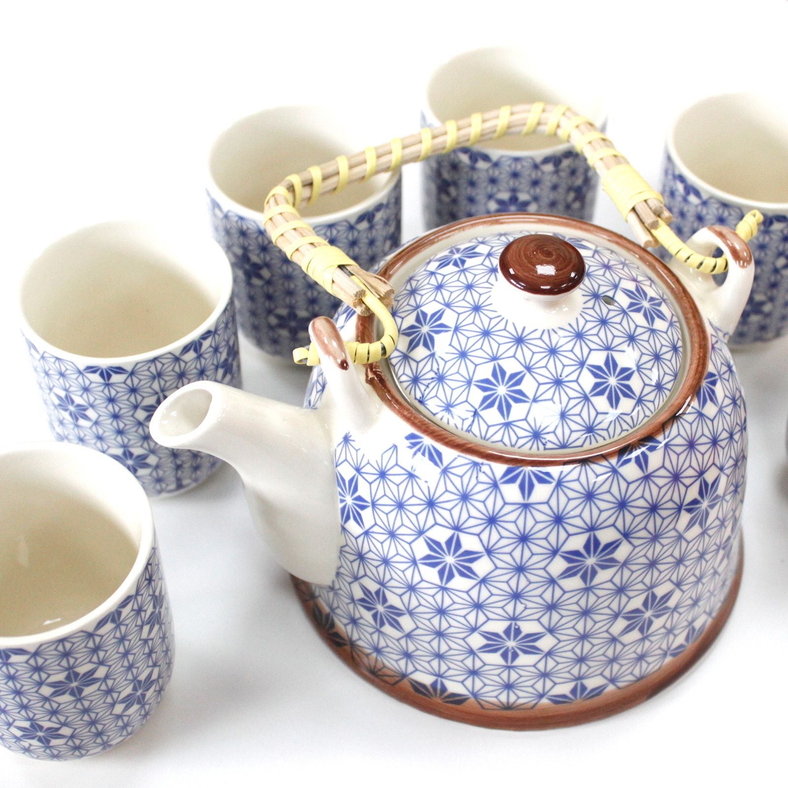 Ceramic teapot and cups with blue geometric pattern on a white background from MVB STUDIO official store.