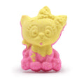 Yellow and pink cat-shaped bath bomb on a white background