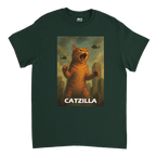Dark green T-shirt featuring a stylised illustration of a giant roaring cat towering over a city, with helicopters flying overhead and the word “Catzilla”.