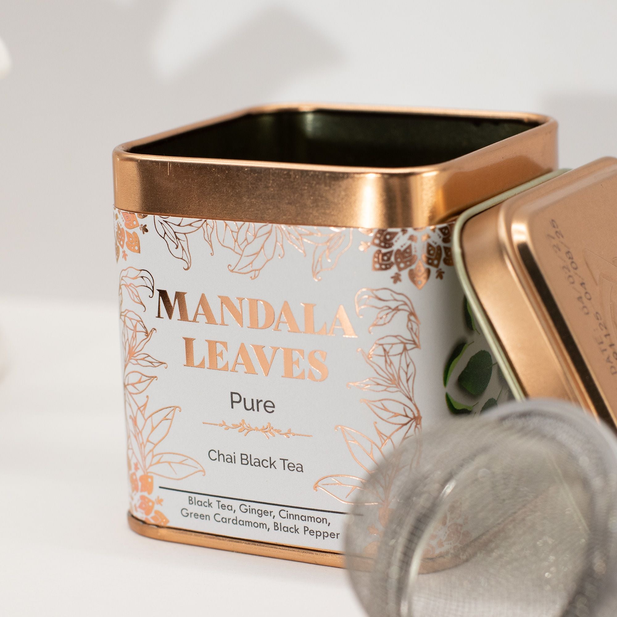 Mandala Chai Black Tea 50g canister with a gold lid on a white background