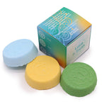 Three colorful bath bombs with a box labeled 'Incant Wisdom' on a white background