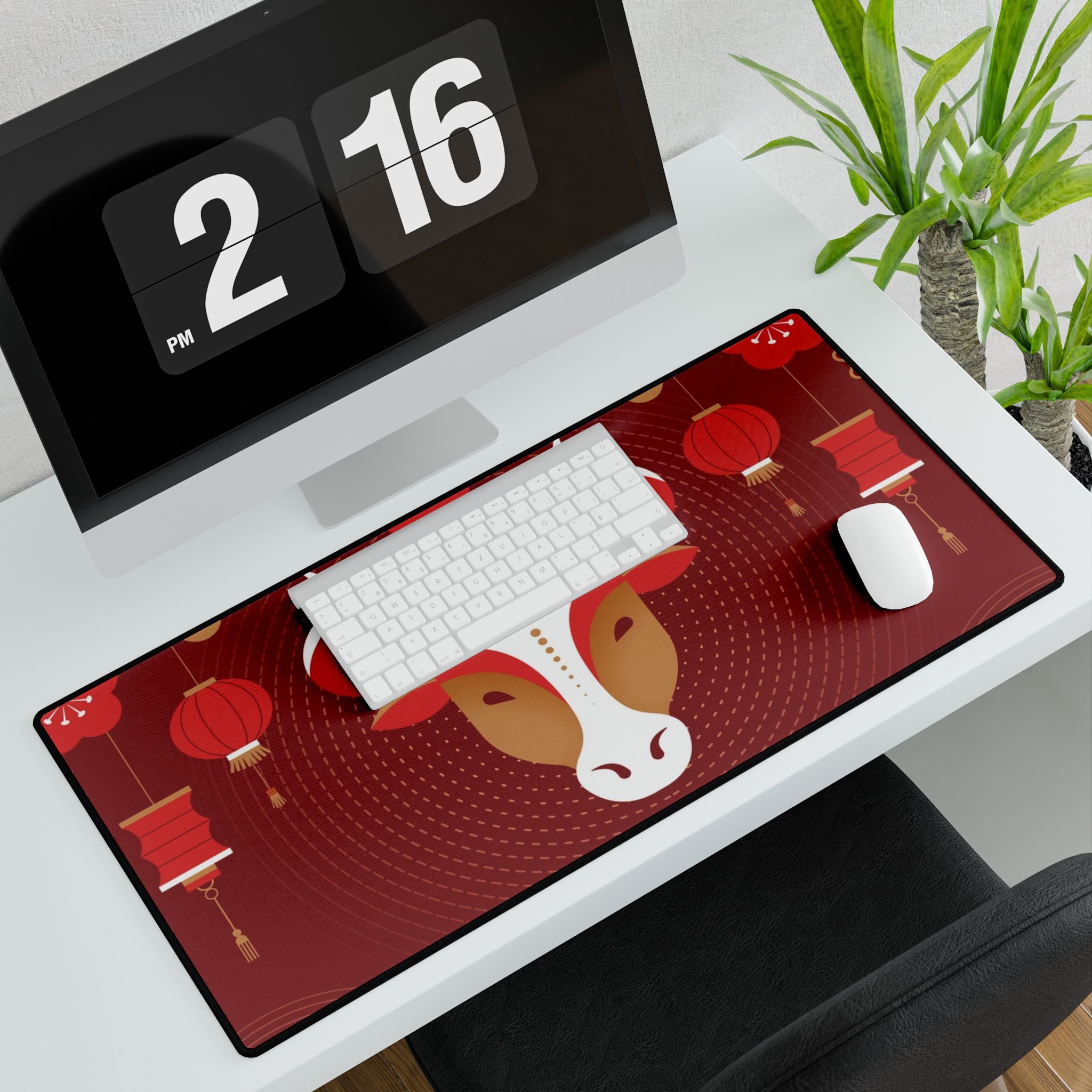 Desk setup with a large desk mat featuring a horse design, keyboard, mouse, and digital clock.