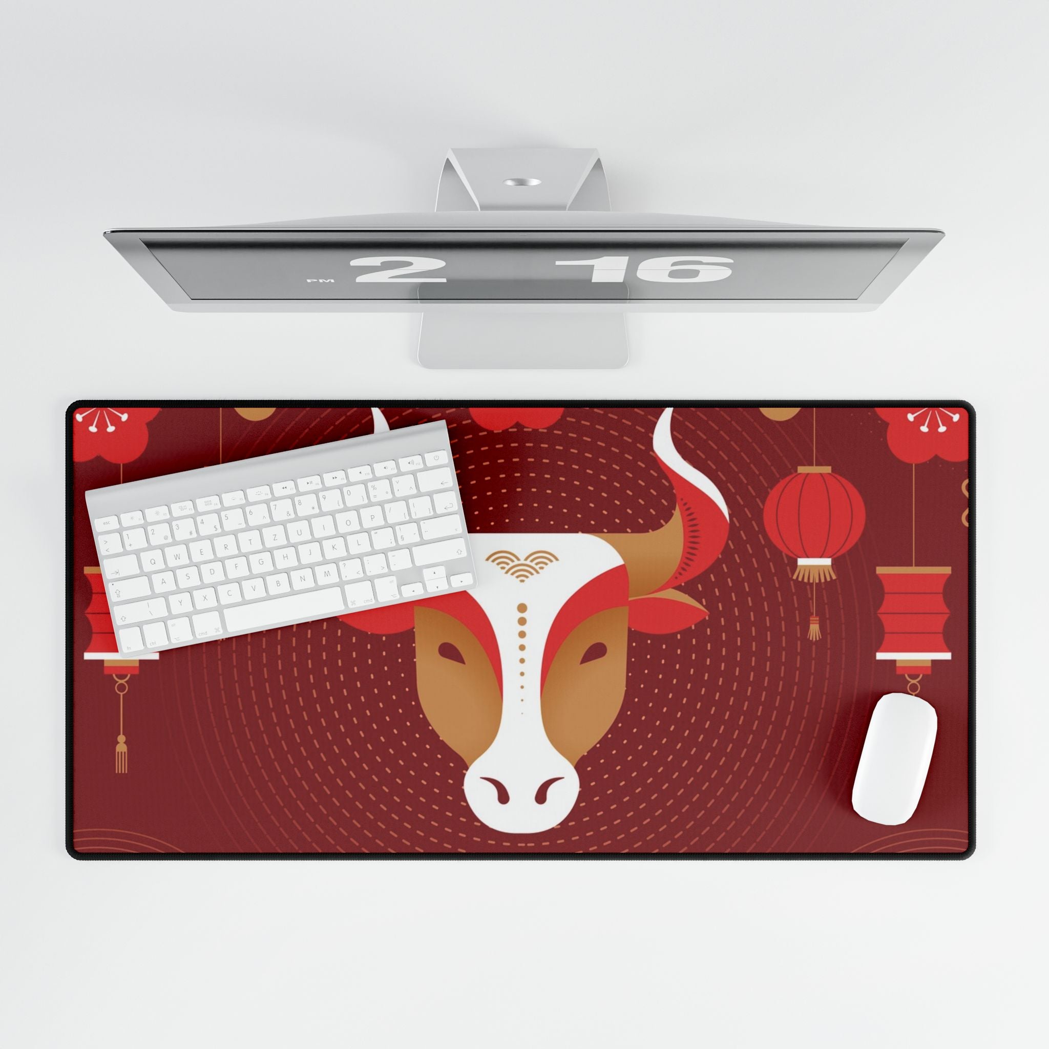 Desk mat with ox design, keyboard, mouse, and computer monitor on a white background