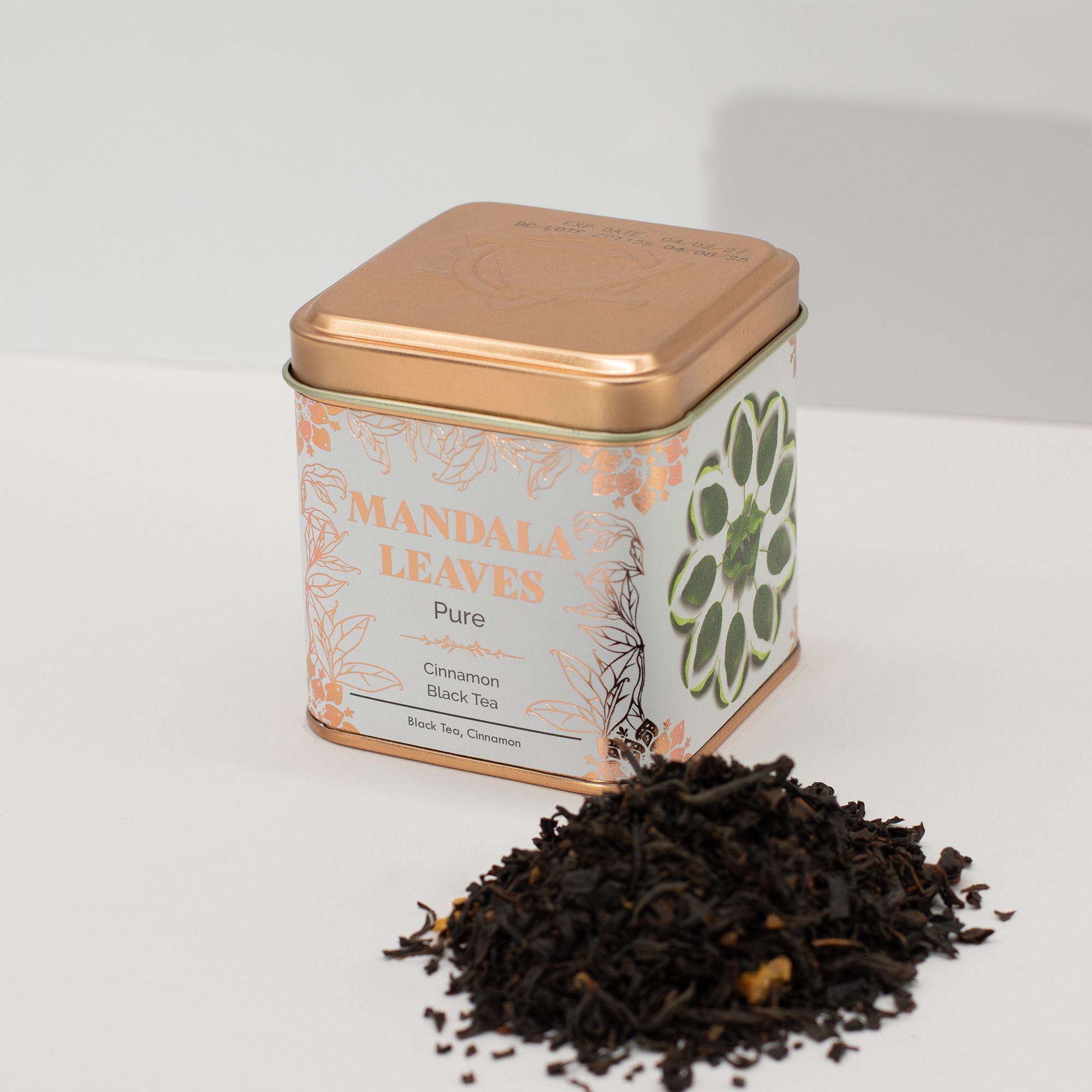 Tea tin labeled 'Mandala Leaves' with Cinnamon Black Tea on a white background
