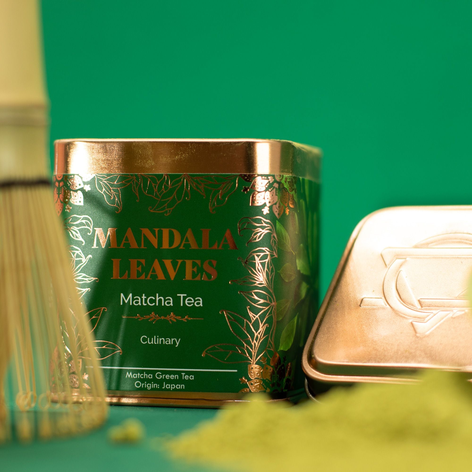 Green tea canister labeled 'Mandala Leaves' with a green background