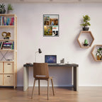 Modern home office with a desk, chair, and wall art
