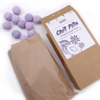 Box of 'Chill Pills' with purple balls on a white background