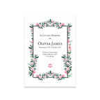 Memorial card with floral design and text on a white background