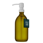 Green soap bottle with pump and 'Kushi' tag on a white background