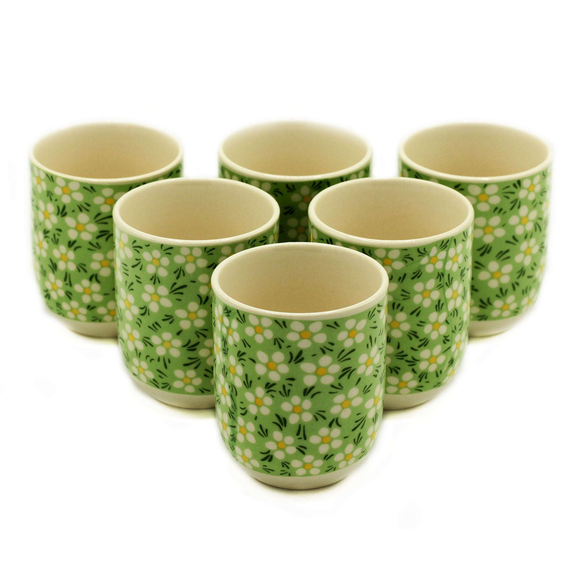 Set of six ceramic cups with floral pattern on a white background