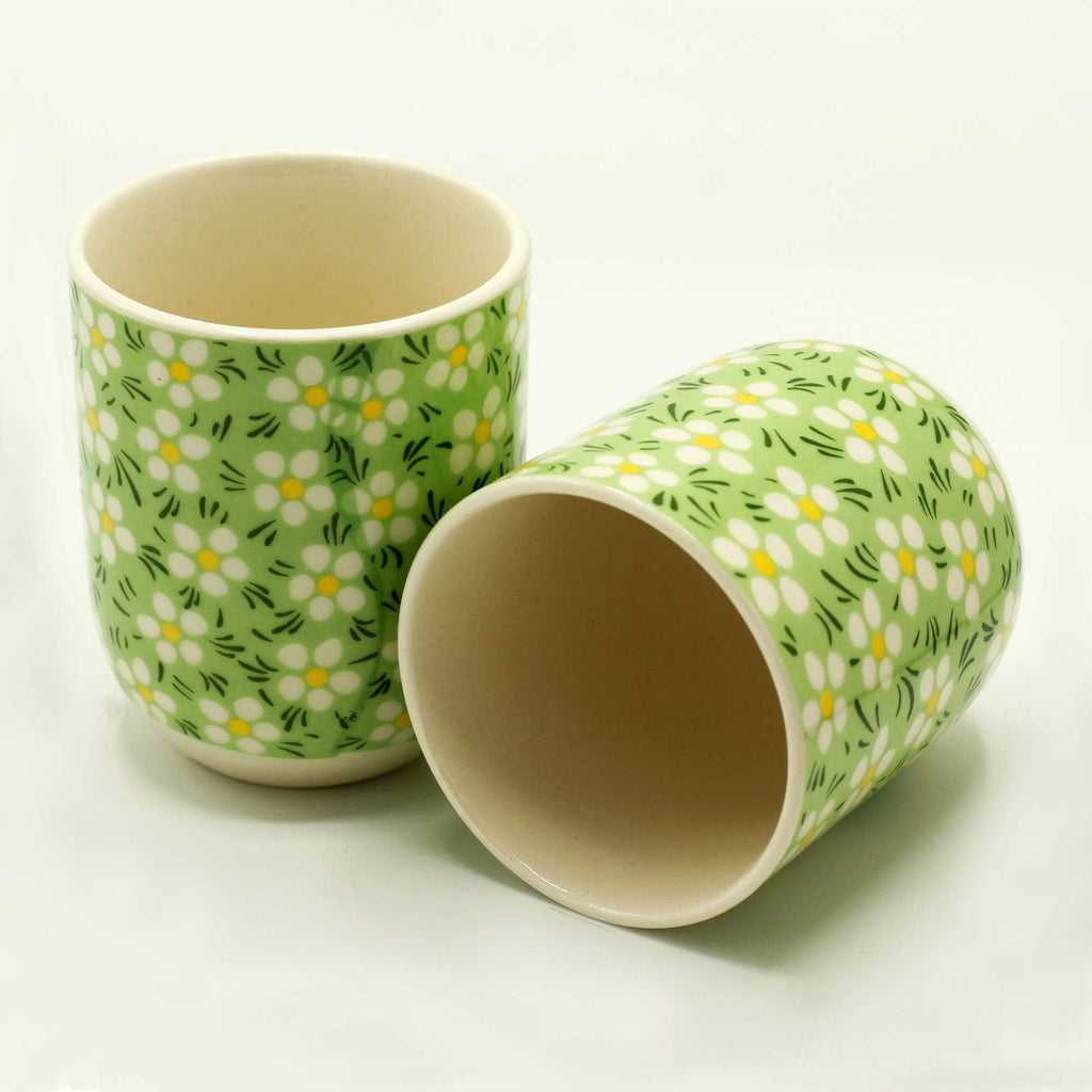 Two ceramic cups with floral pattern on a white background from MVB STUDIO official store.