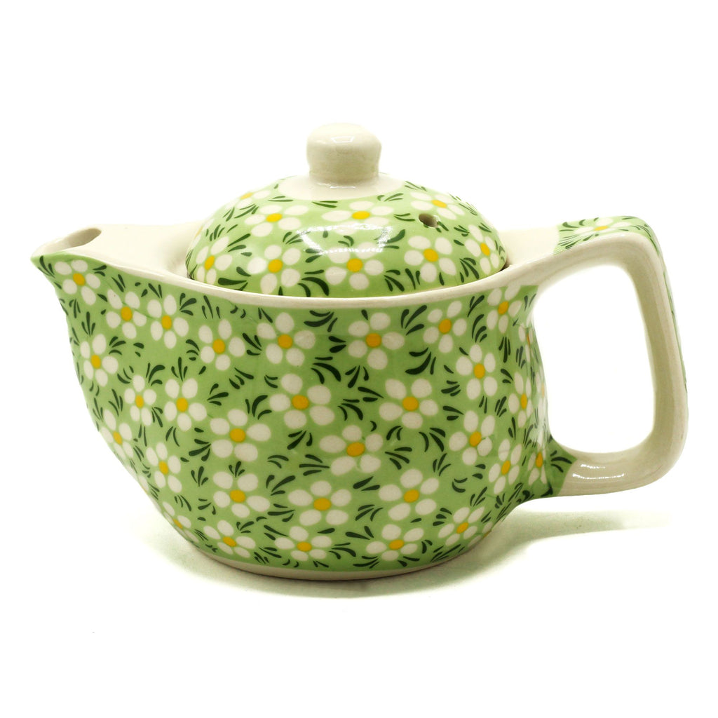 Green ceramic teapot with floral pattern on a white background from MVB STUDIO official store.