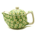 Green ceramic teapot with floral pattern on a white background from MVB STUDIO official store.