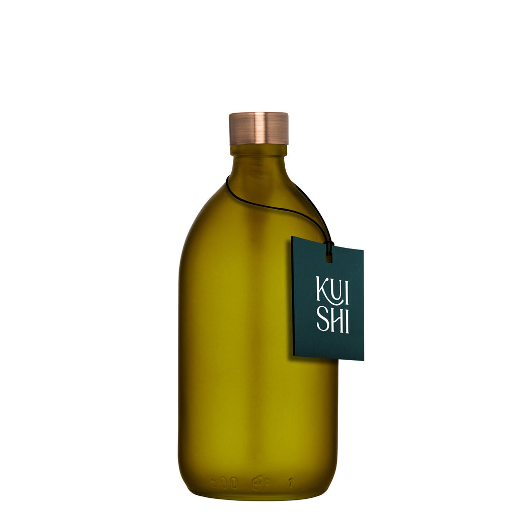 Green bottle with a copper cap and 'KUSH' tag on a white background