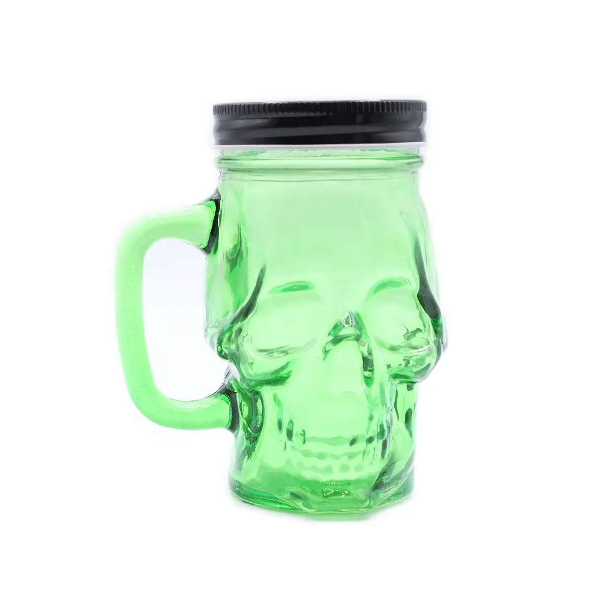 Green skull-shaped jar with a black lid on a white background