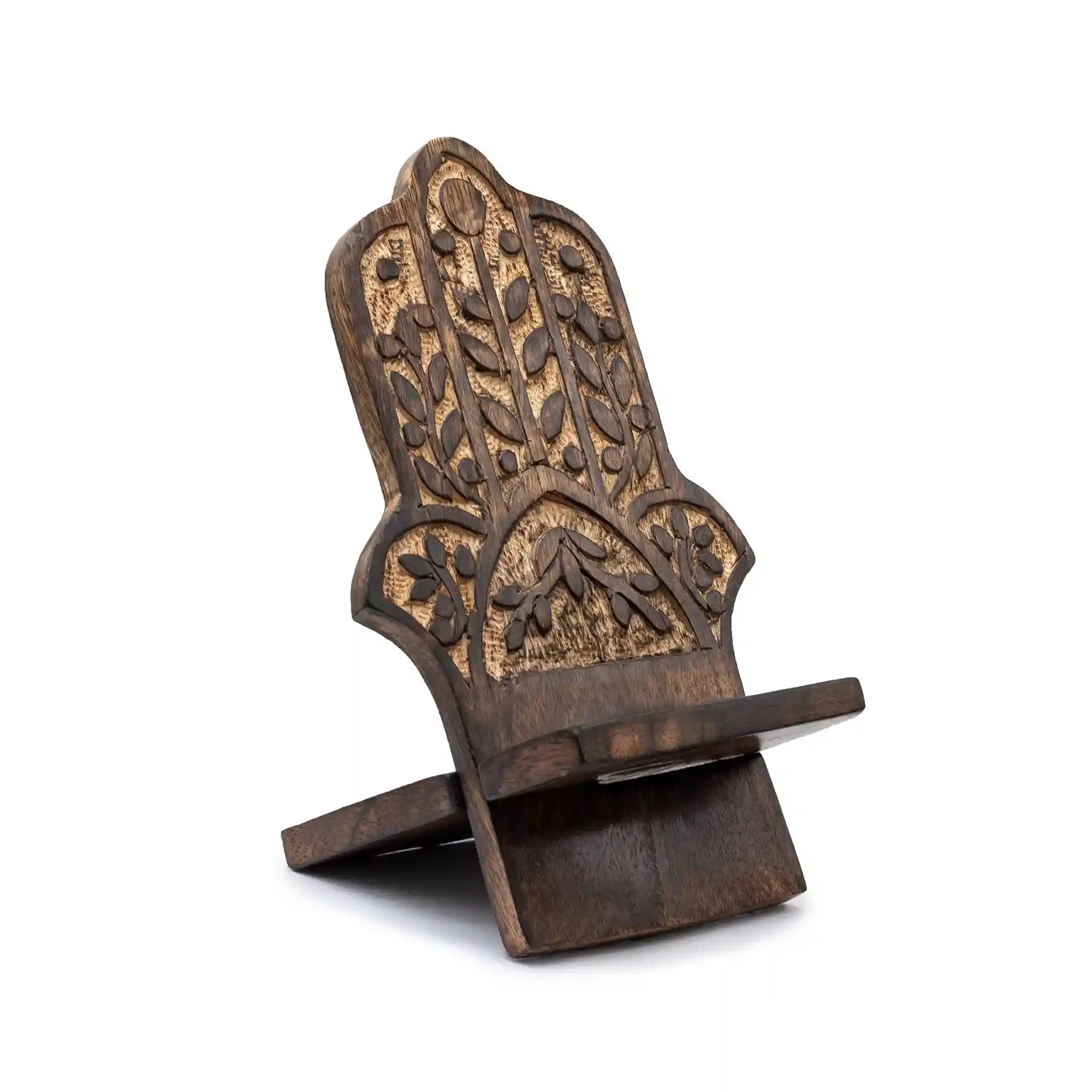 Wooden phone stand with intricate carvings on a white background