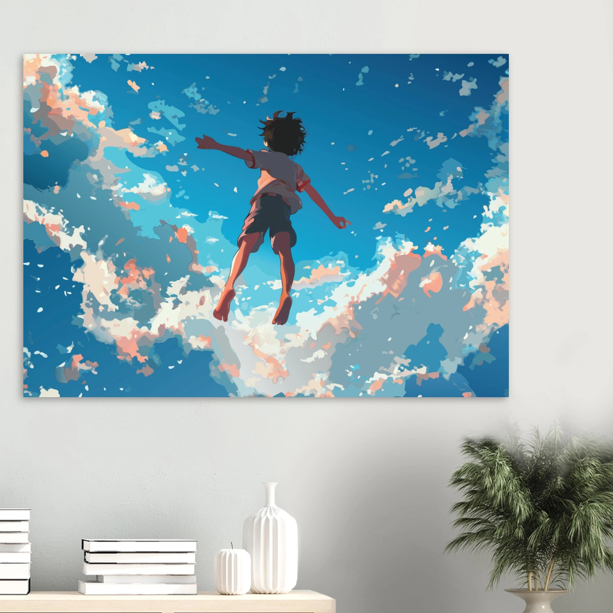 Canvas print of a person leaping through the sky with clouds, displayed on a wall above a shelf.