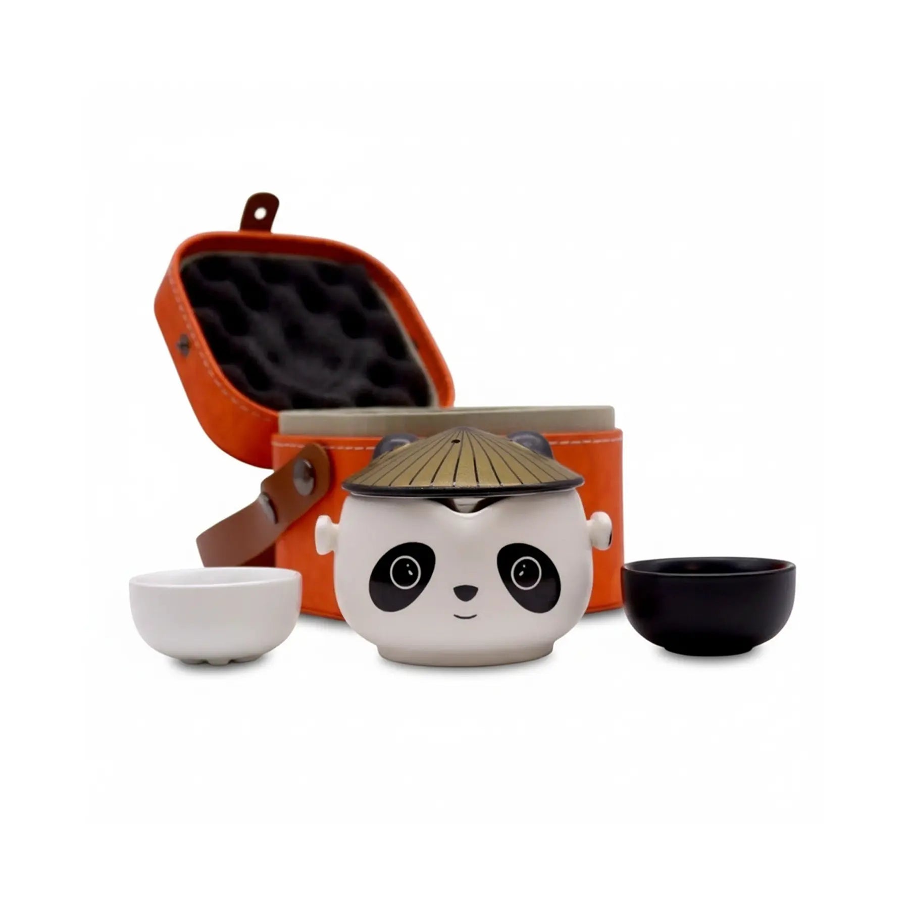 Ceramic panda teapot with a hat, two small bowls, and an orange carrying case on a white background.