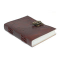 Brown leather notebook with embossed design and brass clasp on a white background