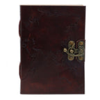Brown leather notebook with embossed design and brass latch on a white background